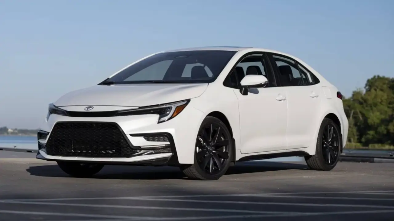 This is a 2026 Toyota Corolla, featuring a redesigned front bumper and sleek black alloy wheels